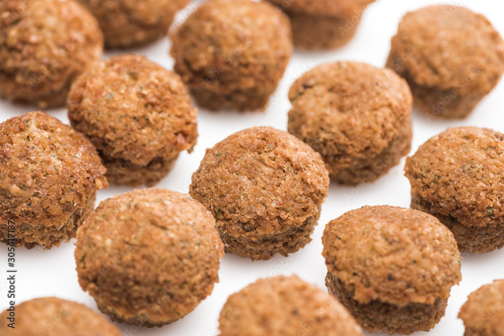 close up view of delicious fresh cooked falafel balls on white background