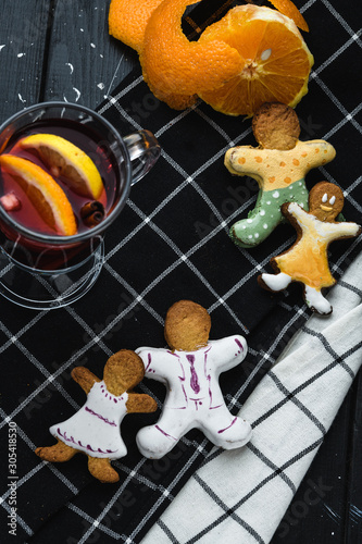 Cookies with fruit tea on a wooden background