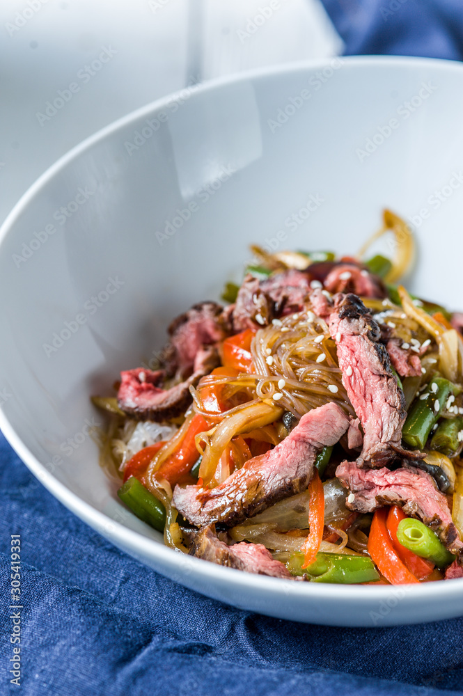 Salad with vegetables and warm meat and sesame seeds. Salad with vegetables and warm meat and sesame seeds.