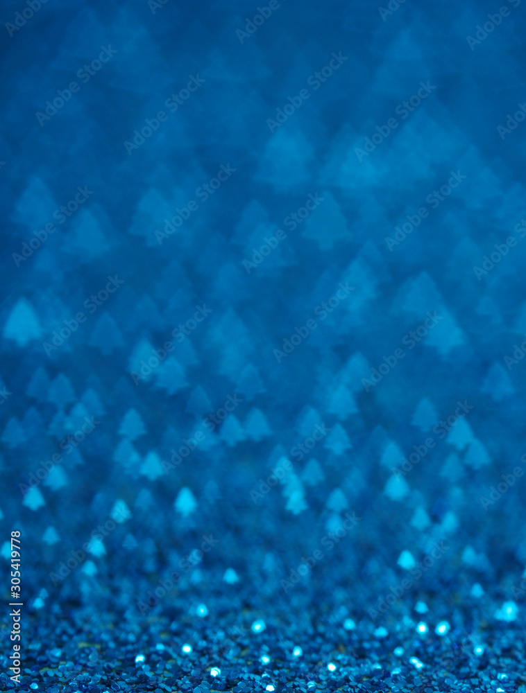 Blue holiday glitter background with Christmas tree bokeh. Blue holiday glitter background with Christmas tree bokeh.