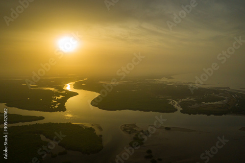 Aerial view of mangrove forest in the  Saloum Delta National Park, Joal Fadiout, Senegal. Photo made by drone from above. Africa Natural Landscape. photo