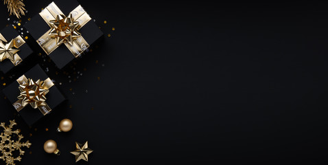 Merry Christmas and Happy Holidays greeting card, frame, banner. New Year. Noel. Christmas golden ornaments and gift on black background top view. Winter xmas holiday theme