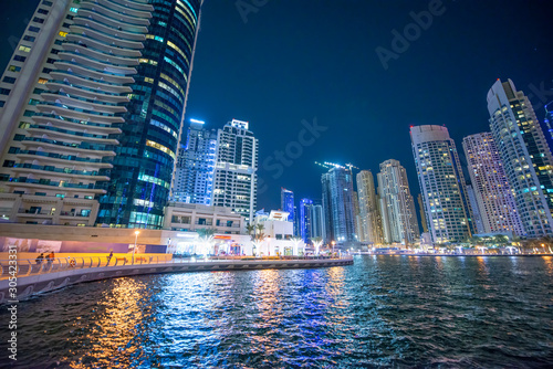 Dubai Marina night skyline. Buildings and river, United Arab Emirates