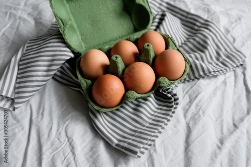 Chicken eggs on cardboard tray for background. Top view  photo