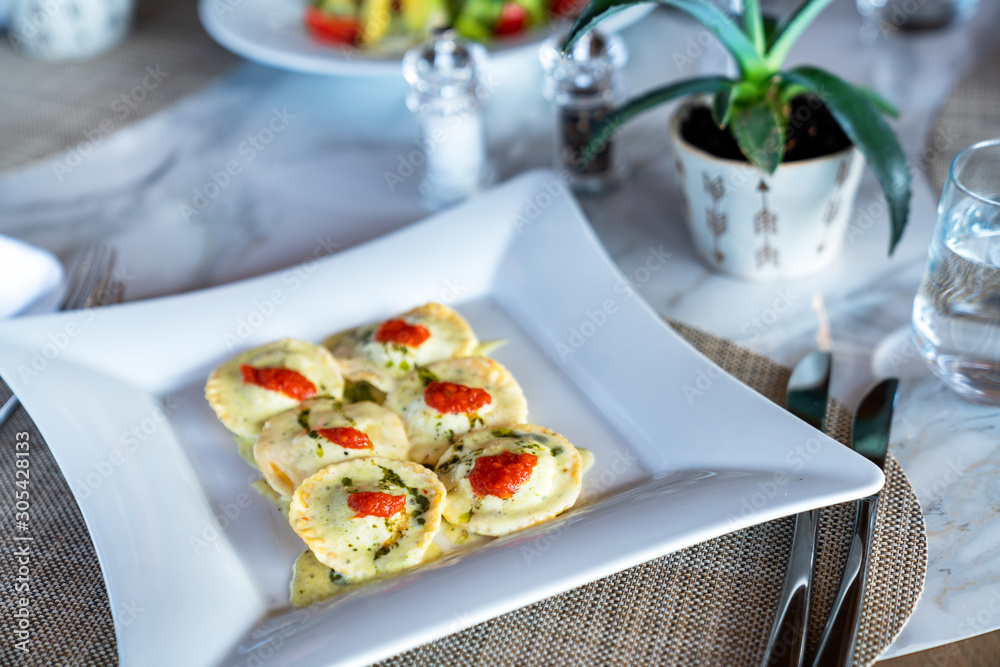 A delicious ravioli is served in a elegance restaurant or hotel A delicious ravioli is served in a elegance restaurant or hotel