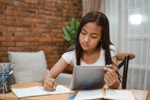 portrait of young teenager junior high school student studying at home
