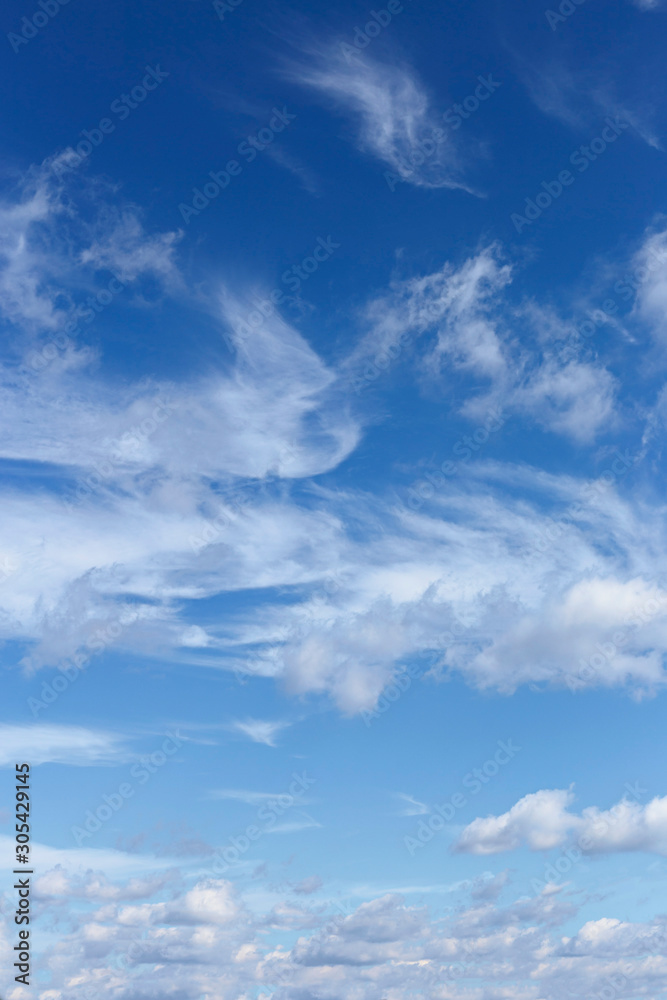 Beautiful blue sky with white cirrus and cumulus clouds as a natural background