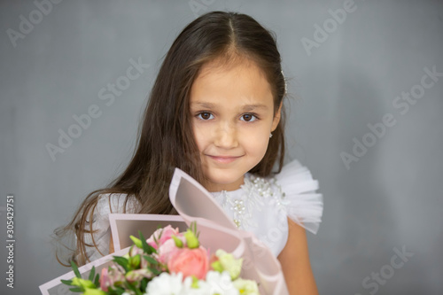 Portrait of a beautiful little indian girl with flowers