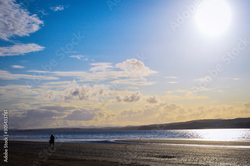 Sunset Reflection on the Sea. Beach, Cloud & Blue Sky Background