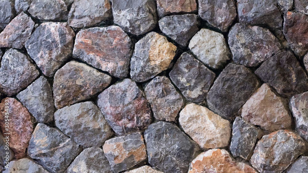 Fototapeta premium pattern gray color of rustic country style design decorative dreal stone wall surface with cement. Background of ancient stone wall. Texture of old .