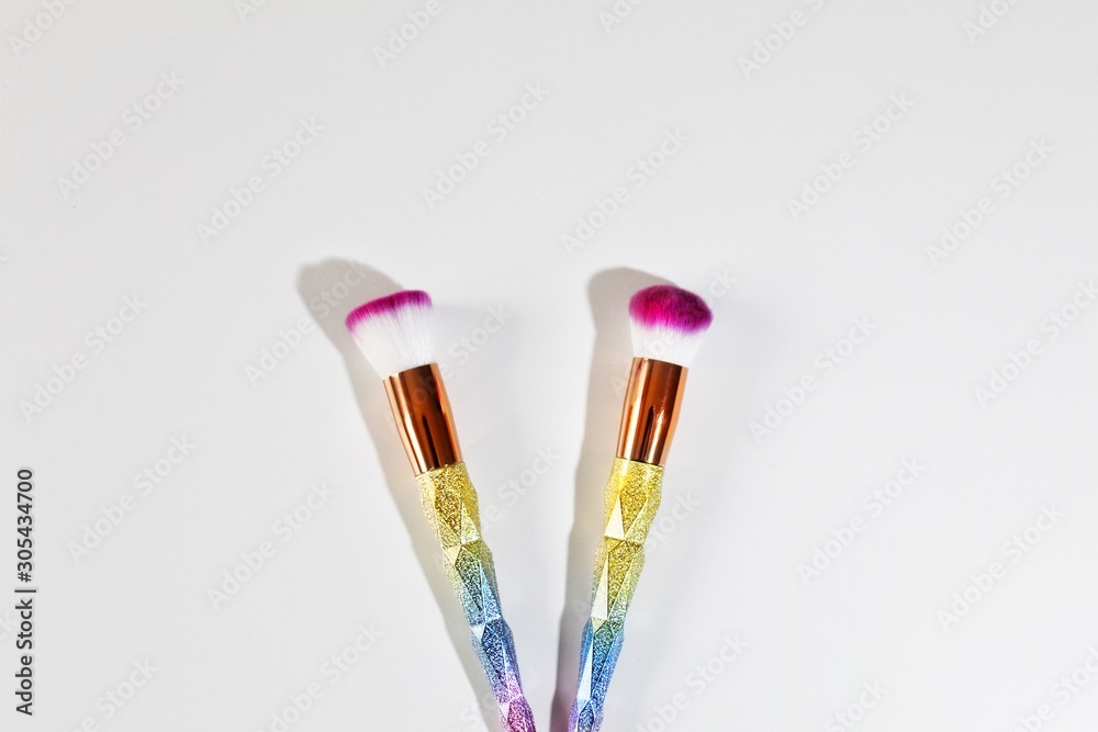 paintbrushes in glass isolated on white background