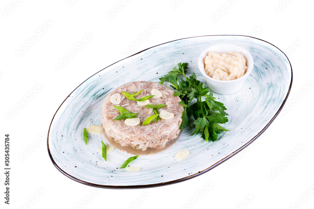 Cold with garlic and horseradish on a plate of greens