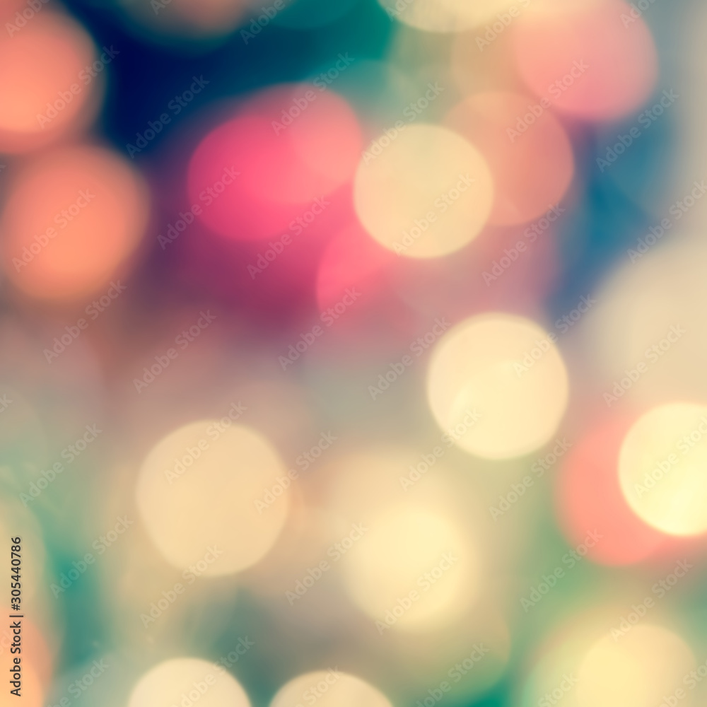 Obraz premium Christmas tree bokeh blur abstract background for merry x'mas party and new year celebration in red green gold color for xmas holiday night light 