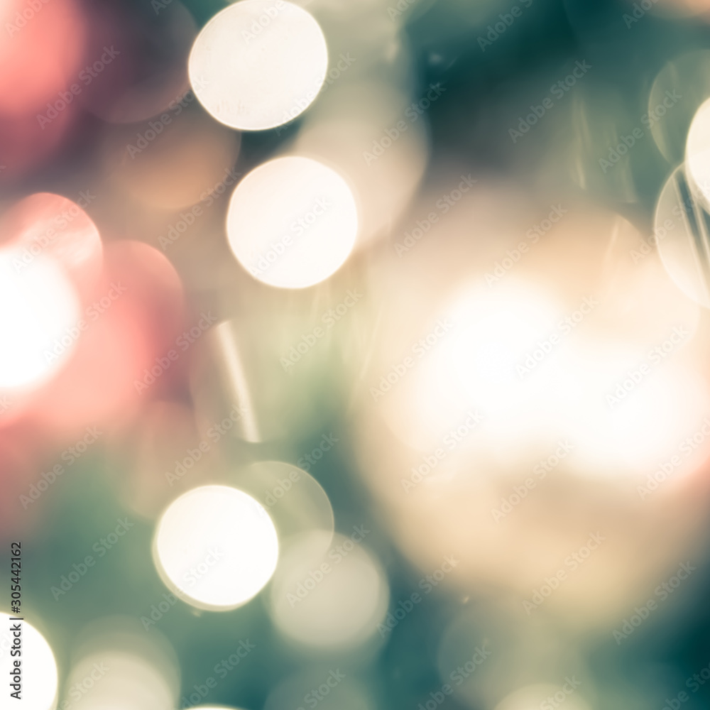 Obraz premium Christmas tree bokeh blur abstract background for merry x'mas party and new year celebration in red green gold color for xmas holiday night light 