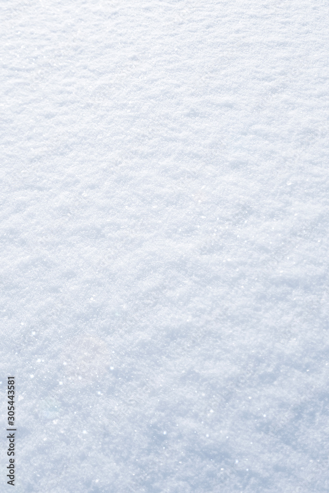 Winter snow background. The texture of fresh, clean, sparkling, freshly fallen snow. Vertikal Mobile wallpaper. Social media mobile story or stories size. Decoration element