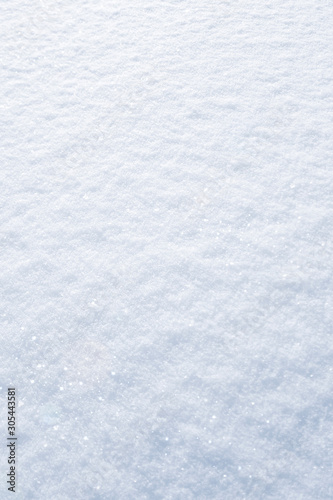 Winter snow background. The texture of fresh, clean, sparkling, freshly fallen snow. Vertikal Mobile wallpaper. Social media mobile story or stories size. Decoration element