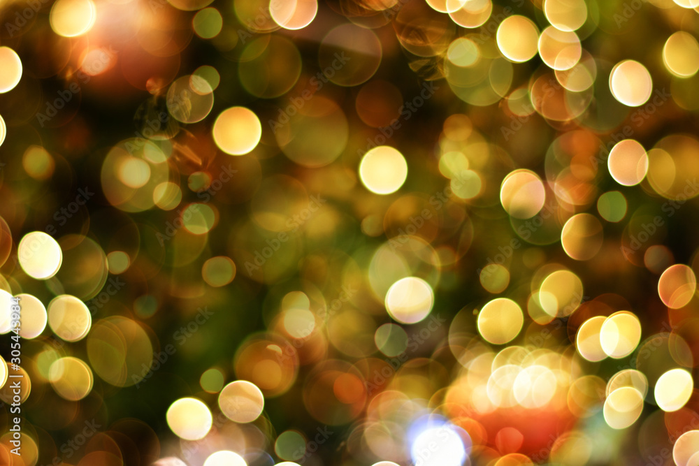 Colorful Christmas Bokeh background of defocused glittering lights.
