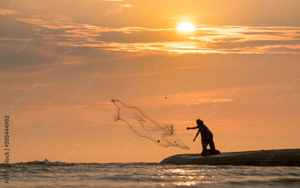 Beautiful sunset nature background, unknown fisherman with net fish on