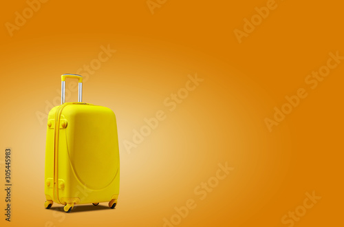 Yellow suitcase is standing against an orange background. A realistic shadow is drawn in under it. Collage. Copy space, close-up.