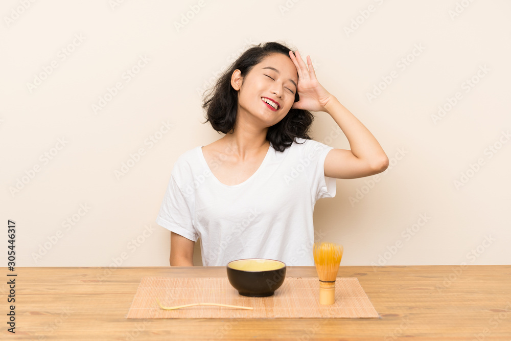 Young asian girl with tea matcha has realized something and intending the solution Young asian girl with tea matcha has realized something and intending the solution