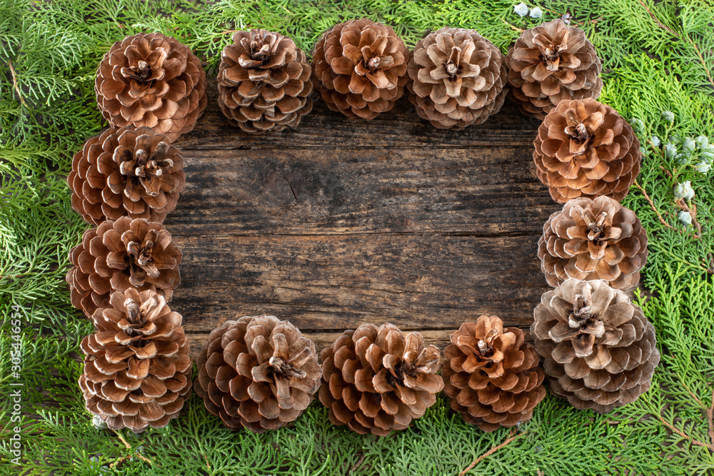 Christmas pine cone garland on the wooden rustic table Christmas pine cone garland on the wooden rustic table
