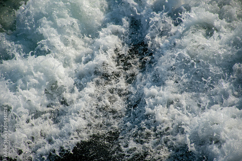 Sea waves left by the boat. Writing area. Background. Wallpaper.