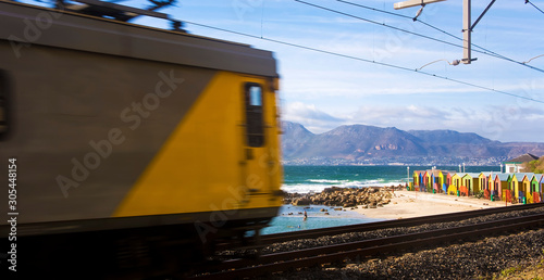 Train pass by St James Beach, Cape Town, South Africa
