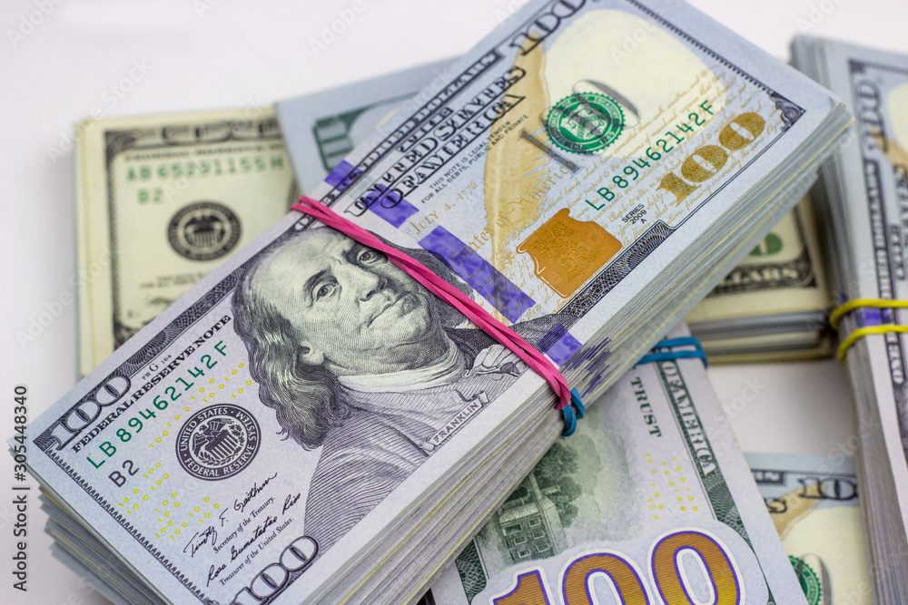 Fototapeta premium American dollar usa packs on money background. Financial concept.