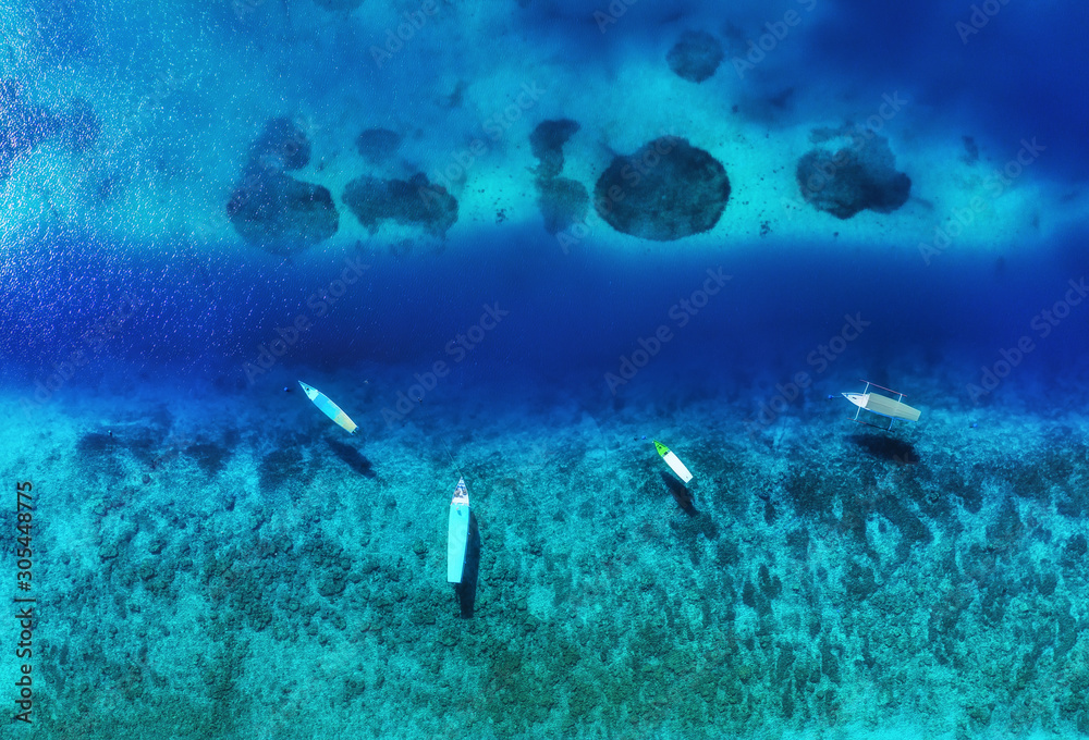 Boats from air. Aerial view on the sea. Summer seascape with clear water in the sunny day. Travel - image Boats from air. Aerial view on the sea. Summer seascape with clear water in the sunny day. Travel - image