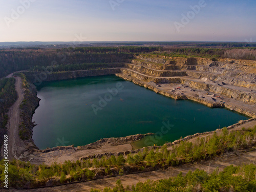 The quarry after the mining of minerals is filled with water. Aerial view.