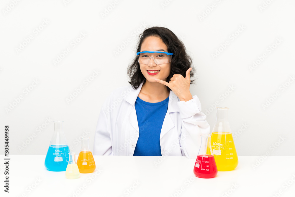 Young scientific asian girl making phone gesture Young scientific asian girl making phone gesture