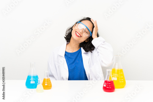 Young scientific asian girl laughing