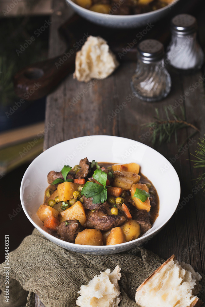 traditional irish beef and guinness beer stew with carrots, potatoes and green peas traditional irish beef and guinness beer stew with carrots, potatoes and green peas