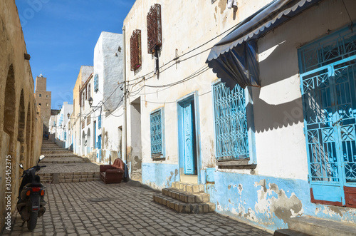 Typical street in the medieval medina of Sousse  Tunisia. The Kasbah tower is visible in the background.