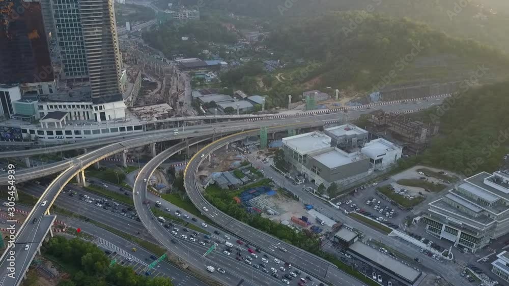Aerial view of elevated highway with busy traffic in Damansara, Malaysia. Aerial view of elevated highway with busy traffic in Damansara, Malaysia.