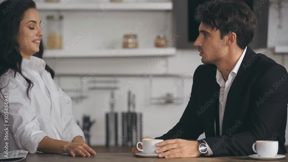 woman talking with businessman and drinking coffee woman talking with businessman and drinking coffee