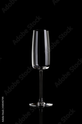 Empty champagne glass isolated on black background.