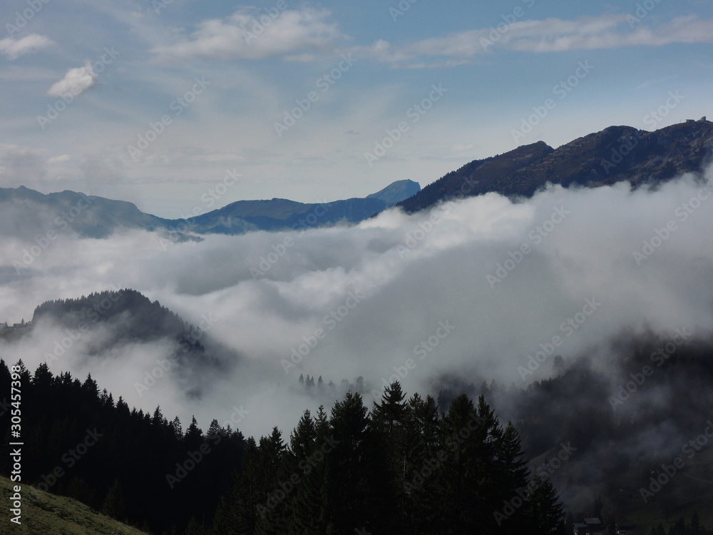 Views of the cloudy valley from the Col des Mosses in the Bernese Alps of Switzerland