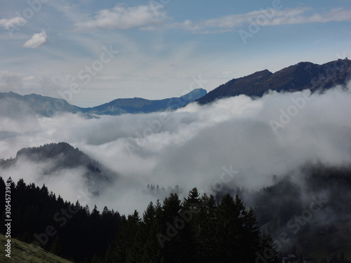 Views of the cloudy valley from the Col des Mosses in the Bernese Alps of Switzerland