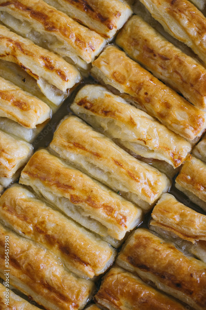 texture of Puff pastry cakes with sugar powder close up