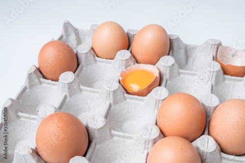 cardboard box with brown chicken eggs