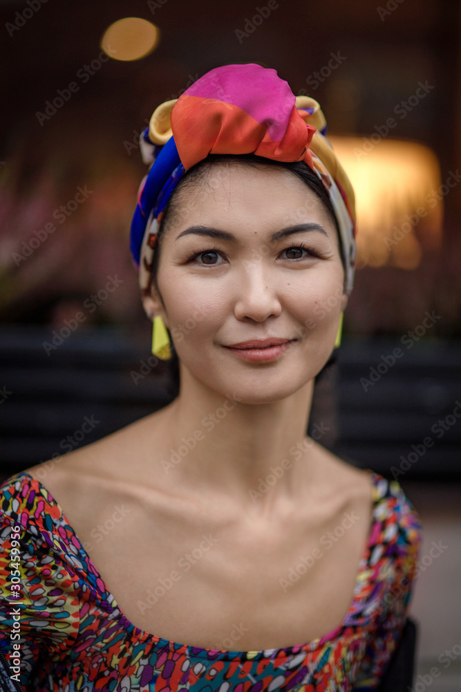 Oriental girl with a scarf on her head
