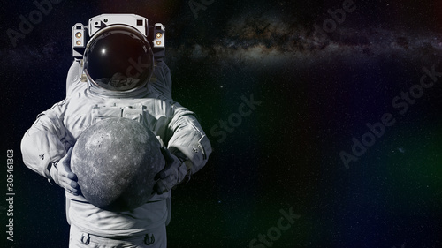 Fototapeta Naklejka Na Ścianę i Meble -  astronaut holding planet Mercury, world of the solar system