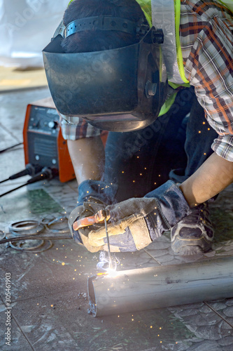 Welders Welding To prepare construction equipment © JKLoma