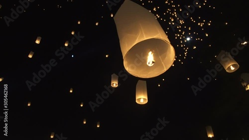 Hand releasing lanterns in festival Chiang Mai Thailand photo