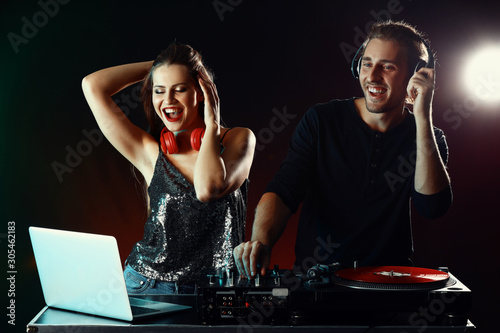 Young djs playing music in ...