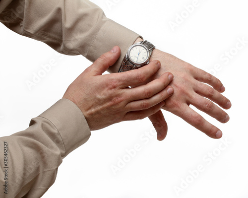 Clock on a hand on a white background