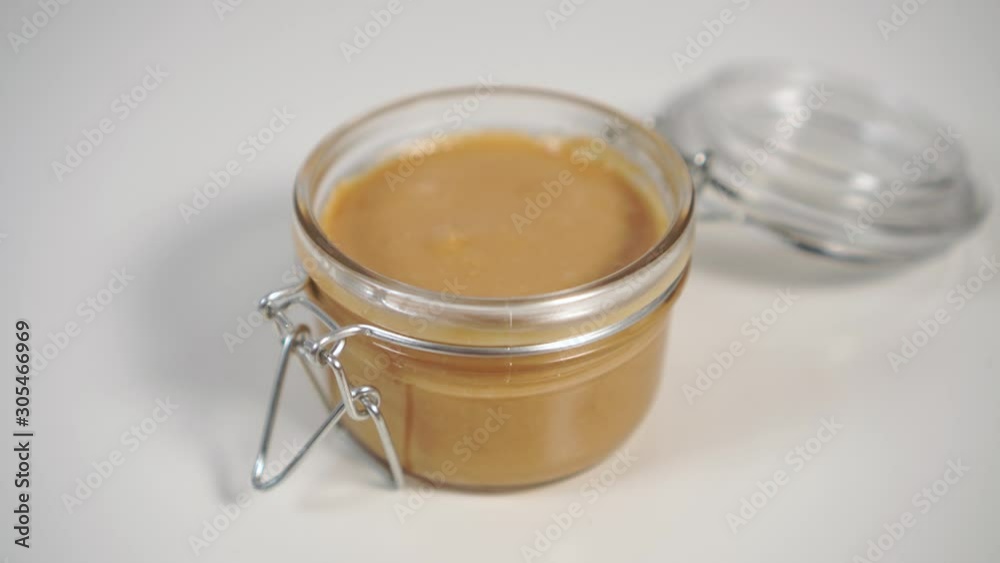 Cereal toast with peanut butter and a glass jar. Natural Organic Food For A Healthy Breakfast Cereal toast with peanut butter and a glass jar. Natural Organic Food For A Healthy Breakfast