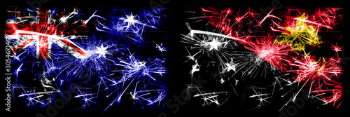 Australia, Ozzie vs Papua New Guinea New Year celebration sparkling fireworks flags concept background. Combination of two abstract states flags. © Vlad