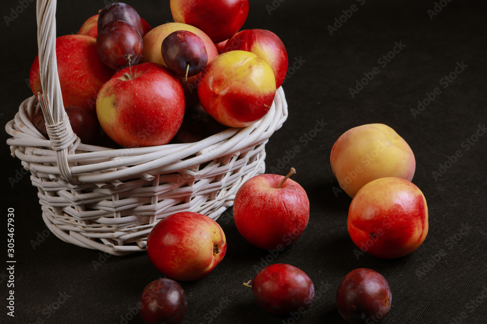 full basket of apples on a black background full basket of apples on a black background